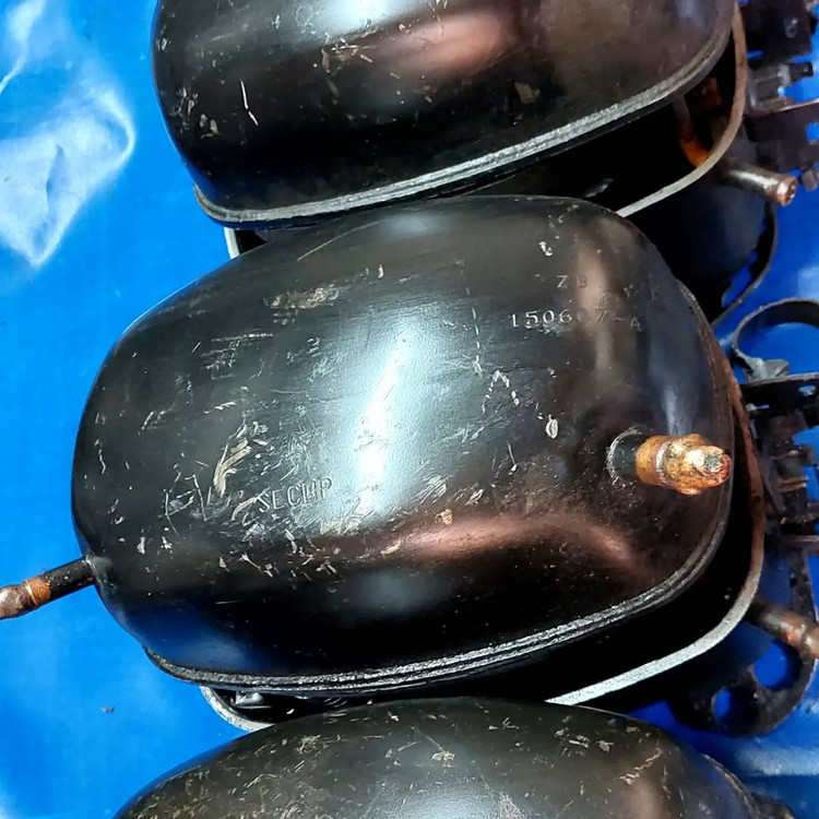 Close-up of Danfoss compressor components for maintenance and